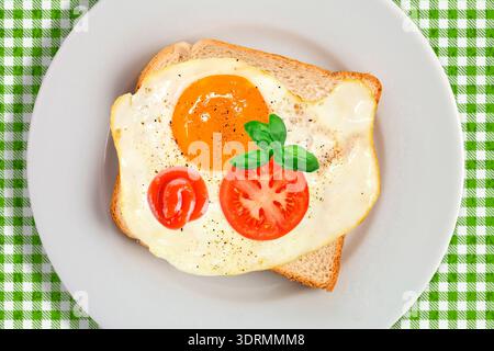 Breakfast with fried egg on toast Stock Photo