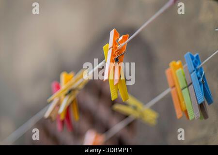 colorful clothes pins on a wire in a street Alghero Stock Photo