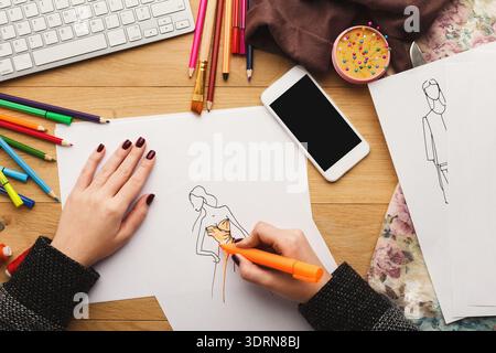 Creative Process in a Design Studio With Sketches, Tools, and Workspace Elements Being Used Stock Photo