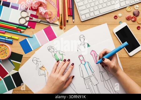 Creative Process in a Fashion Design Studio With Sketches and Materials on a Workspace Stock Photo