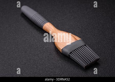 Brush, silicone kitchen utensils for cooking and baking at home. Silicone brush Stock Photo