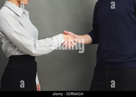 Handshake Between Two People in a Studio Setting During a Business Meeting Stock Photo