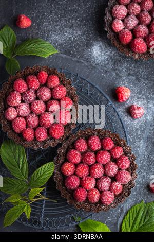 Chocolate tarts with fresh raspberry Stock Photo