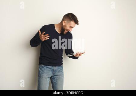 Collection of Joyful Moments in a Modern Setting With a Man Using a Tablet Indoors Stock Photo