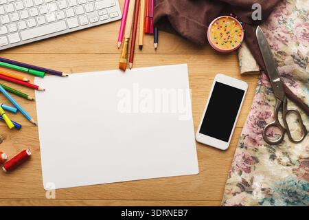 Creative Workspace Arrangement With Materials for Crafting and Design Activities Stock Photo