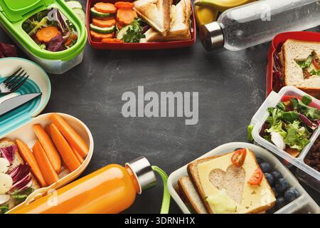 Collage of Lunch Boxes on a Table Filled With Fresh Food and Drinks for Enjoying Meals Stock Photo