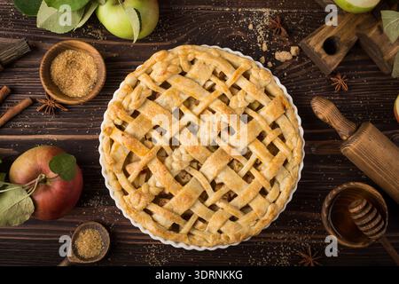 Apple pie and ingredients on wooden background Stock Photo