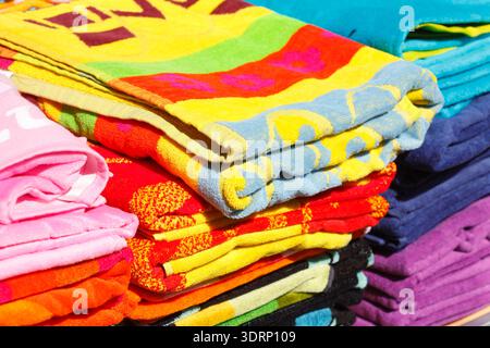 Stacked colourful terry towels Stock Photo