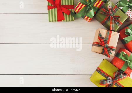 Colorful Collage of Gift Boxes Arranged on Wooden Surface for Celebration and Joy Stock Photo