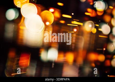 Abstract blurred lights create a vibrant, colorful background with a mix of warm and cool tones, evoking a sense of motion and e Stock Photo