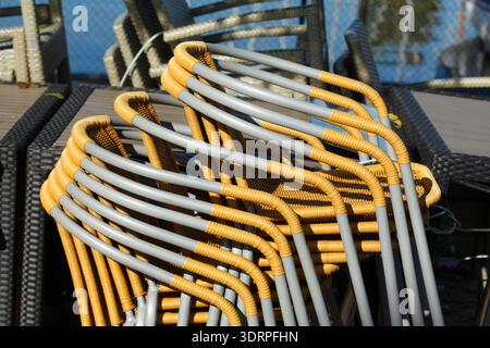 Stacked metal chairs Stock Photo
