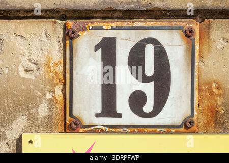 Old house number plate No. 19 on house wall, Germany Stock Photo