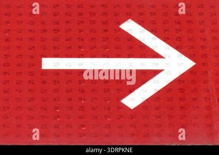 White arrow on red background Stock Photo