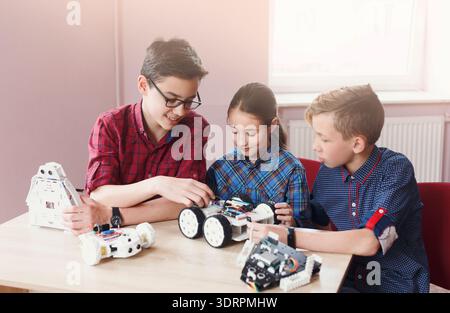 Students Engage in Robotics Project at School During Daytime Activity Focusing on Building Robots Stock Photo