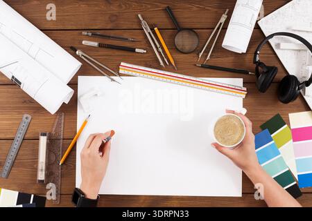 Creative Workspace for Design Projects Featuring Tools and Materials for Planning Stock Photo