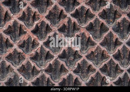 Closeup detail view of mughal carved red sandstone slab with water droplets pattern in fountain, Jahangir tomb, Lahore, Pakistan Stock Photo