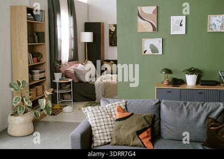 Modern Living Room Interior Featuring Cozy Bedroom and Decorative Wall Art Stock Photo