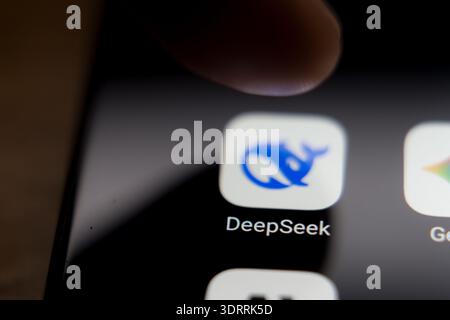 Close-up of DeepSeek AI mobile app icon on a smartphone screen, showcasing popular artificial intelligence chatbot applications and digital technology Stock Photo