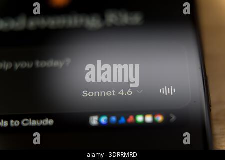 Claude Sonnet 4.6 mobile application interface on a smartphone screen, featuring a personalized greeting and tool access for advanced AI conversationa Stock Photo