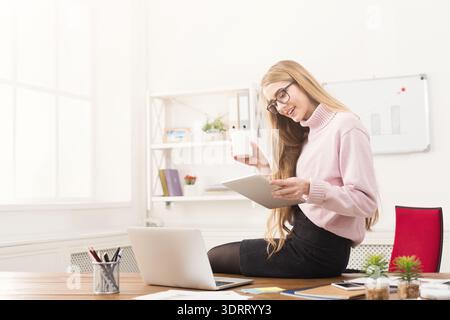 Creative Workspace Collage Featuring a Woman Using a Tablet and Smiling Stock Photo