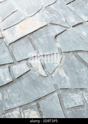 Aerial view of stone pavement creating a mosaic of textures and tones, where the gray and light hues blend seamlessly, Sicilia, Italy. Stock Photo