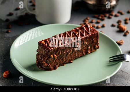 Chocolate nut cake slice with coffee cup Stock Photo