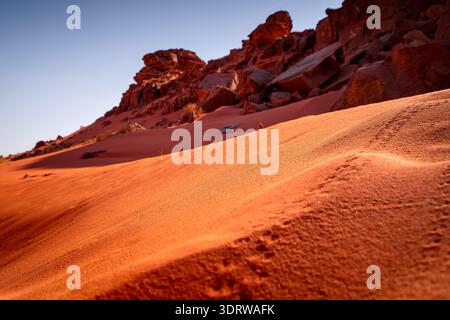 Wild desert landscape with red dunes and rocks on a hot day, Wadi Rum. The most beautiful landscapes of Jordan. Stock Photo
