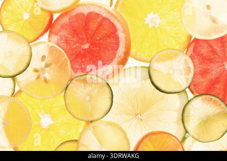 Collection of Various Fruit Slices Arranged in a Colorful and Bright Mosaic Pattern Stock Photo
