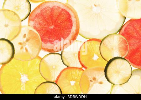Fresh Fruit Collage of Citrus Slices and Colors on White Background Stock Photo
