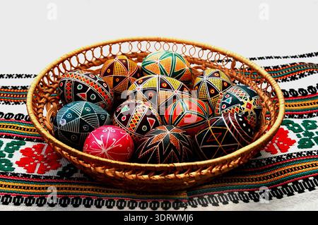 Festive Easter background featuring an Easter bread cake adorned with glaze, chocolate, and eggs. Ideal for an Easter greeting card, ad, promotion, or Stock Photo