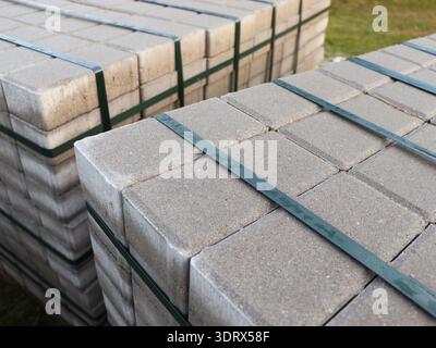 Stack of paving stone on construction site. Bricks for paving stones stacked in stacks Stock Photo