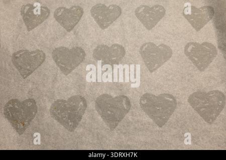 Heart shaped imprints from creating ginger bread cookies for Christmas. Concept photo. Stock Photo