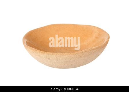 beige ceramic bowl with a natural textured finish, isolated on a white background. Rustic pottery design Stock Photo