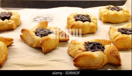 Traditional Finnish Christmas cakes called Joulutorttu. Puff pastry with plum cream. Very tasty. Stock Photo