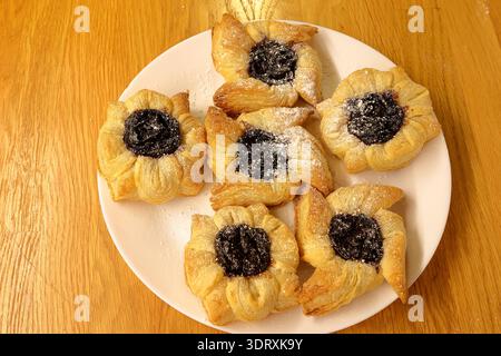 Traditional Finnish Christmas cakes called Joulutorttu. Puff pastry with plum cream. Very tasty. Stock Photo