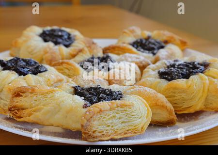 Traditional Finnish Christmas cakes called Joulutorttu. Puff pastry with plum cream. Very tasty. Stock Photo