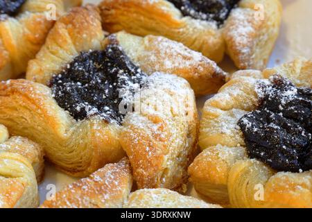 Traditional Finnish Christmas cakes called Joulutorttu. Puff pastry with plum cream. Very tasty. Stock Photo