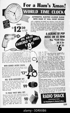 A vintage monochrome advertisement from the Radio Shack Corporation, located in Boston, Massachusetts. The page features 1950s holiday gift ideas, including a World Time Clock for "Hams," a Fairchild power drill, and MGM pop music albums on 45 RPM records. It showcases mid-century consumer electronics and hardware prices, highlighting products like a 13-piece twist drill set and accessory kits. The layout reflects classic mid-20th-century catalog marketing and graphic design styles. Stock Photo