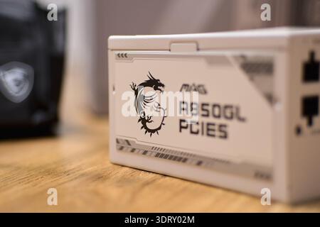 Tyumen, Russia-February 15, 2026: Power supply from MSI for personal computer assembly in studio setting during installation process Stock Photo
