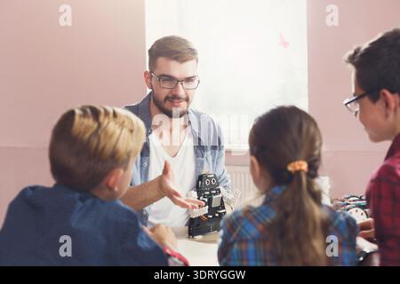 Discussion About Robotics With Children at ICC Change in a Classroom Setting Stock Photo