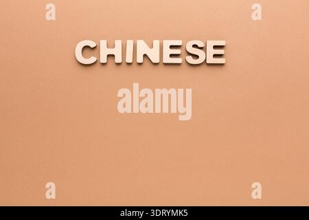 Bright Colored Wall Displays the Word Chinese in Simple Letters Stock Photo
