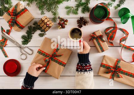 Gift Wrapping Session With Coffee and Decorations During Holiday Season Stock Photo