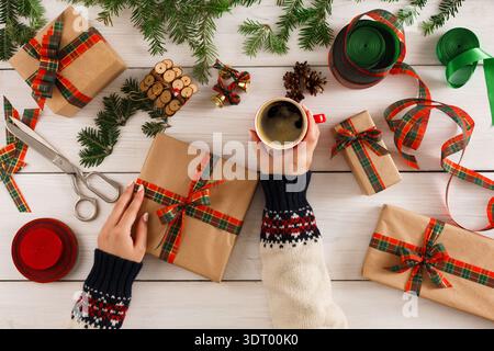 Gift Wrapping Session With Coffee and Supplies for a Festive Celebration at Home Stock Photo