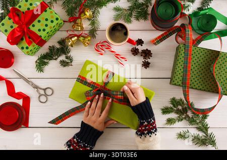 Gift Wrapping Session With Festive Decorations and Supplies During the Holiday Season Stock Photo
