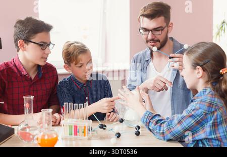 Students Participate in a Science Experiment Focusing on Chemistry Concepts During Class Time Stock Photo