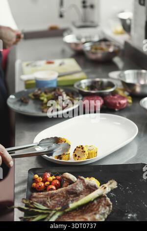 Collage of Culinary Preparation in a Modern Kitchen Setting With Various Dishes Displayed Stock Photo