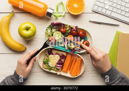 Creative Food Collage Made With Fresh Vegetables and Fruits on a White Table With a Keyboard Stock Photo