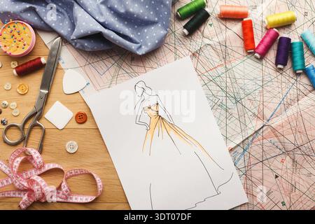Collage of Sewing Tools, Fabric, and Sketches in a Creative Sewing Setting at Home Stock Photo
