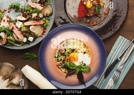 Dinner Collage With Various Dishes Showcased on Different Plates Stock Photo