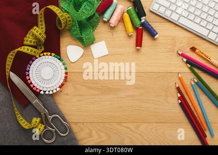 Crafting Set Featuring Sewing Tools, Colorful Threads, and Design Materials on a Workspace Stock Photo